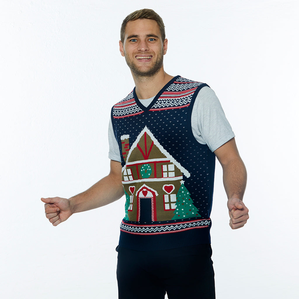 En mand iført en julesweater med julemønster.